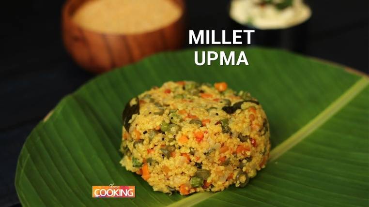 On large green leave, putting a Millet Upma - Healthy Indian Snacks List 