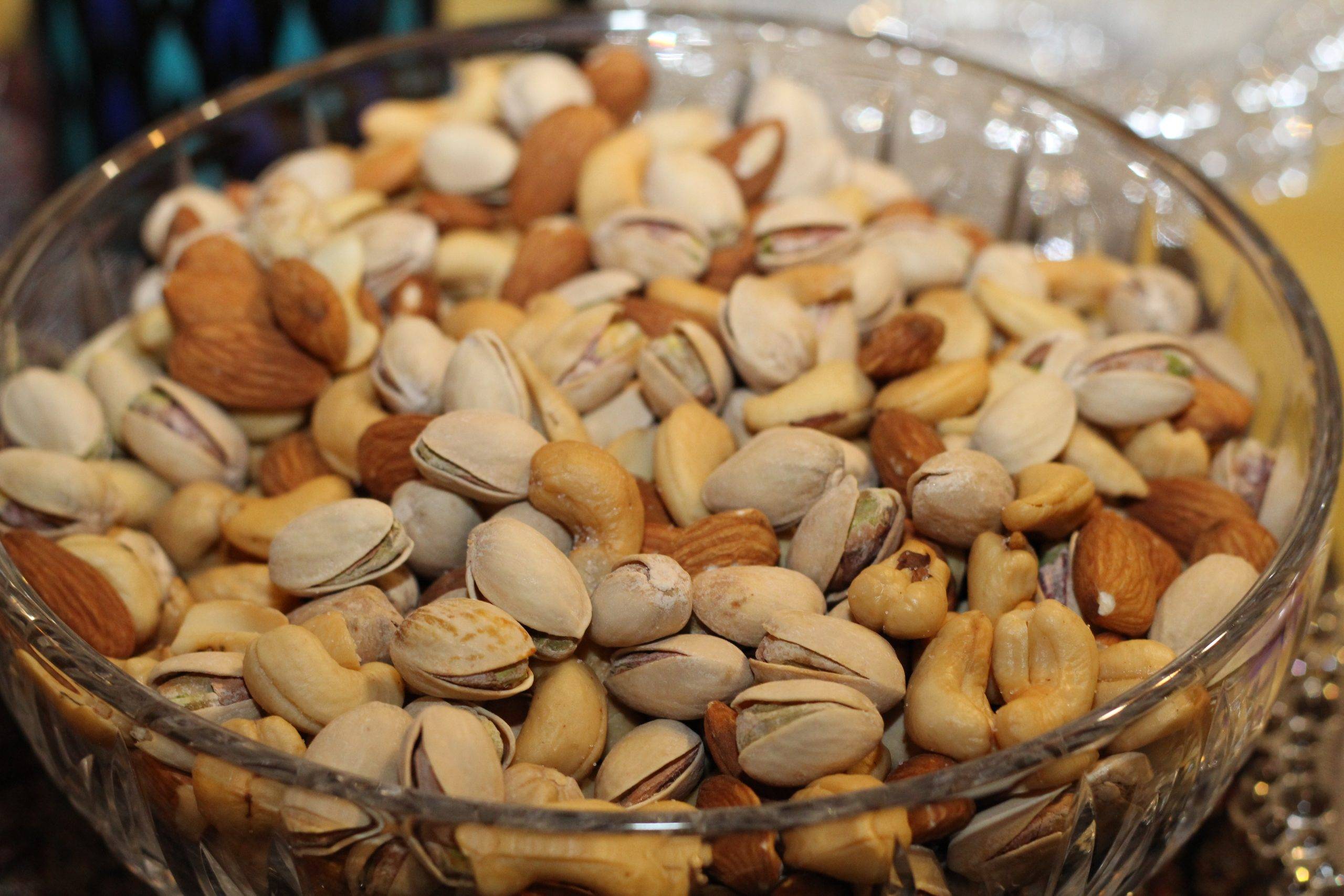 A glass bowl is full of Nuts | Breast size reduction