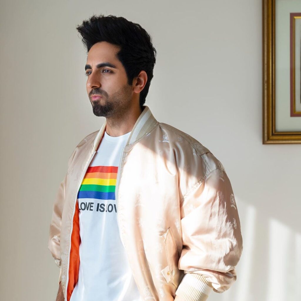Aayushman Khurana hairstyle - posing in the jacket and white t-shirt