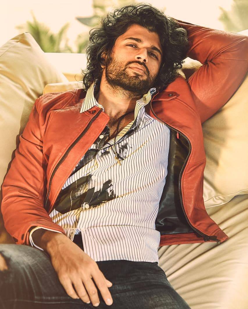 Vijay Deverakonda top model IndiaVijay Deverakonda top model India - lying down on beddown on bed, posing...