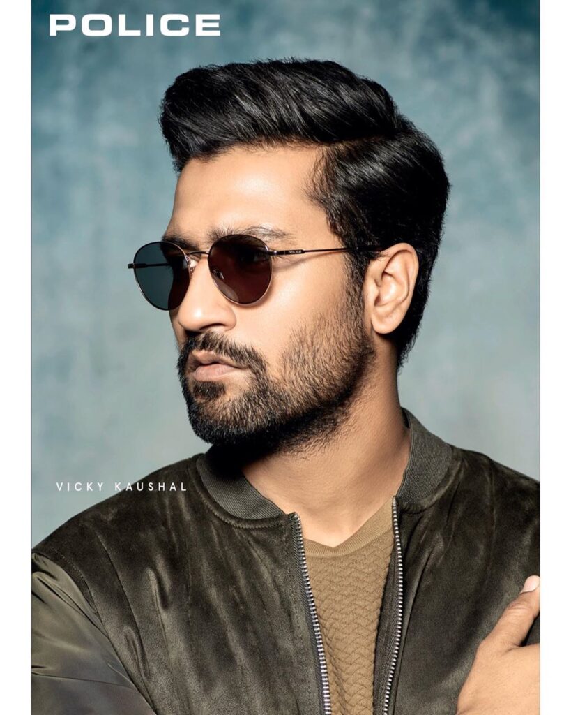 Vicky Kaushal Hairstyle - Have shades and wearing green jacket