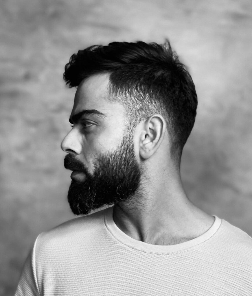 Virat Kohli Hairstyle - Black n white picture, volume beard and looking other side of the camera - showing his left profile