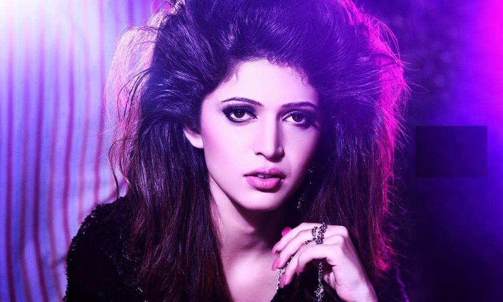 Charlie Chauhan - posing portrait with open hair and black dress