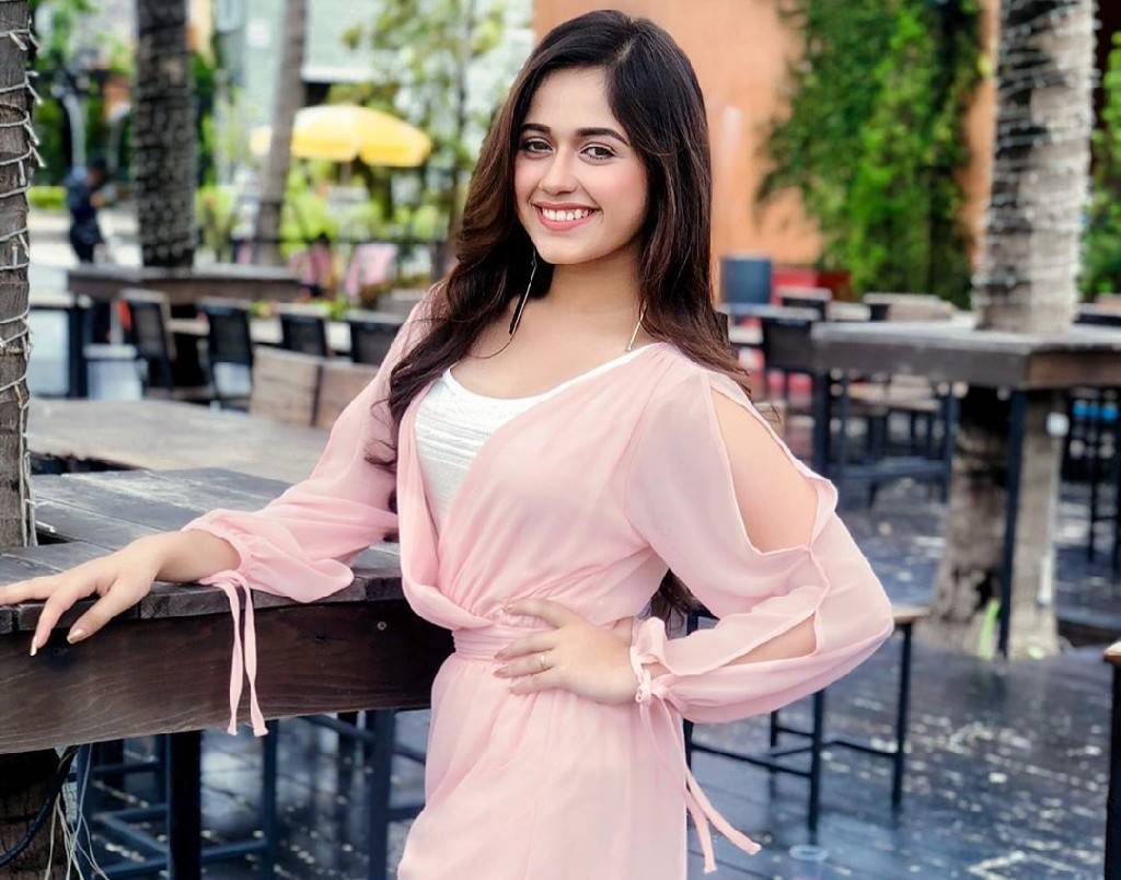 Jannat Zubair - posing with a beautiful smile wear pink and white dress