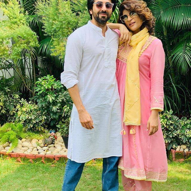 Ayushmann Khurana married to Tahira Kashyap (January) - celebrity couple standing pose together in Indian attires