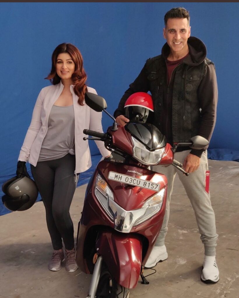 Akshay Kumar married to Twinkle Khanna (December) -  Couple poses with scooty in sports attire