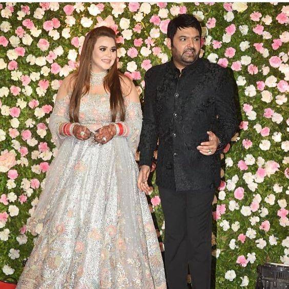 Kapil Sharma Weds November Born Ginni Chatrath - both are posing together on their celebration day wearing Bhartiye/Indian attires black and grey