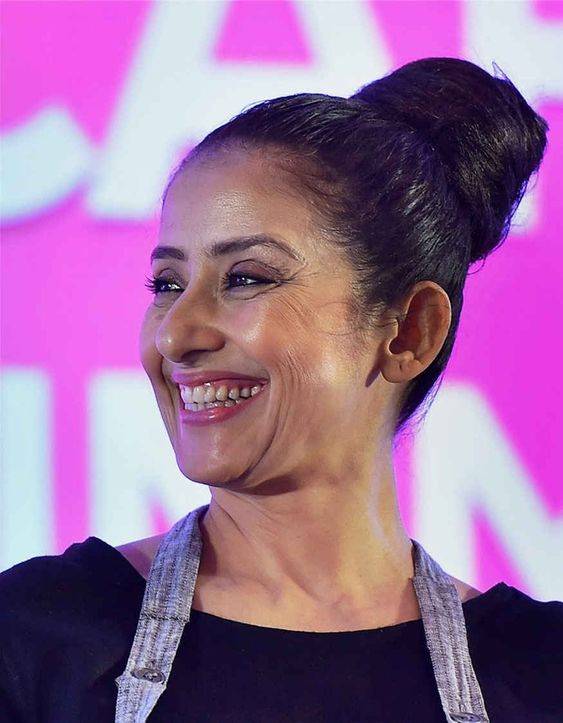 Manisha koirala posing with smile & tie hair