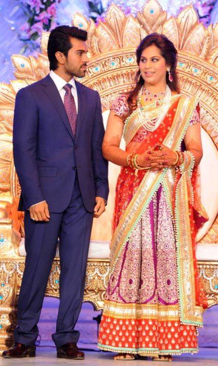 Ram Charan weds July Born Upasana Kamineni - both are wearing Indian attire & looking each other