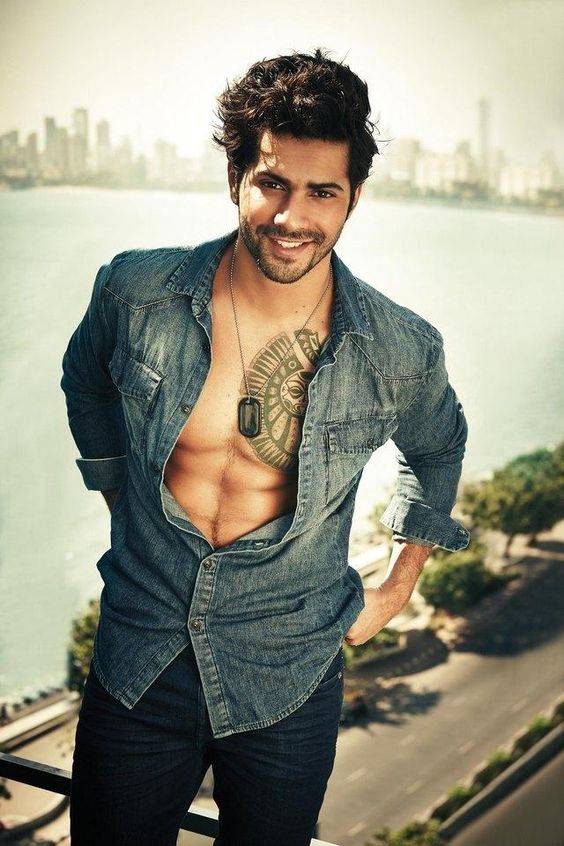 Varun Dhawan standing in open jeans shirt pose