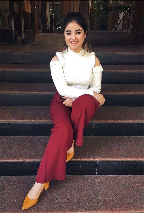 Zaira wasim sitting on stairs