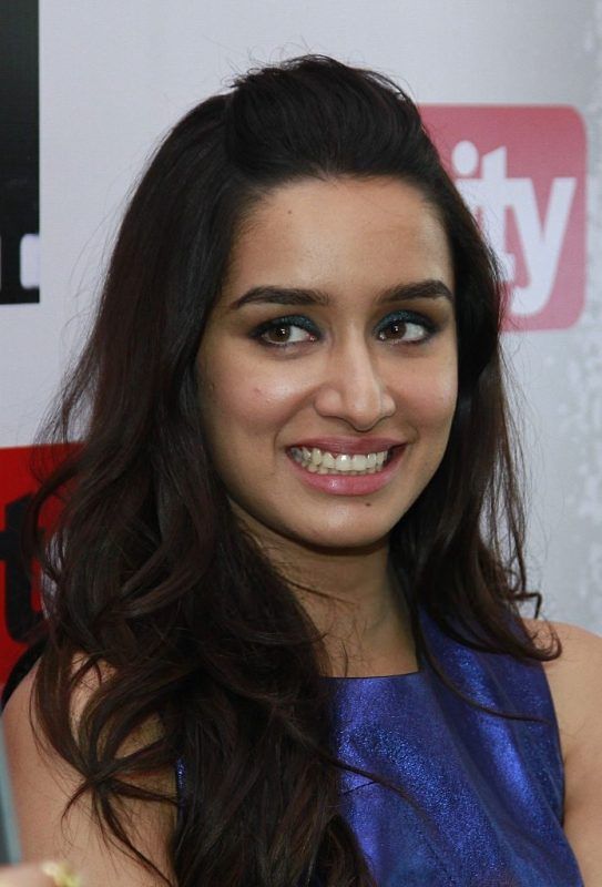Shraddha Kapoor wearing blue dress in pose with her smile
