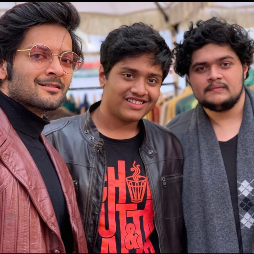 Ali Fazal pose with textured hairdo hairstyle & standing with his known