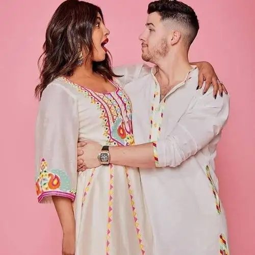 Nick Jonas hugging Priyanka Chopra, who is giving a surprising look - Actors Who Tied the Knot With Older Women 