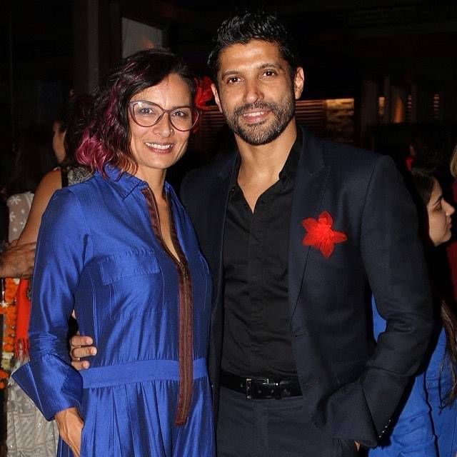 Farhan Akhtar in black suit and Adhuna Bhabani in blue dress smiling and posing for camera - highest paid divorce in bollywood
