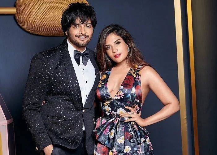 Richa Chada and Ali Faizal posing for camera in glittery attire - bollywood couples list