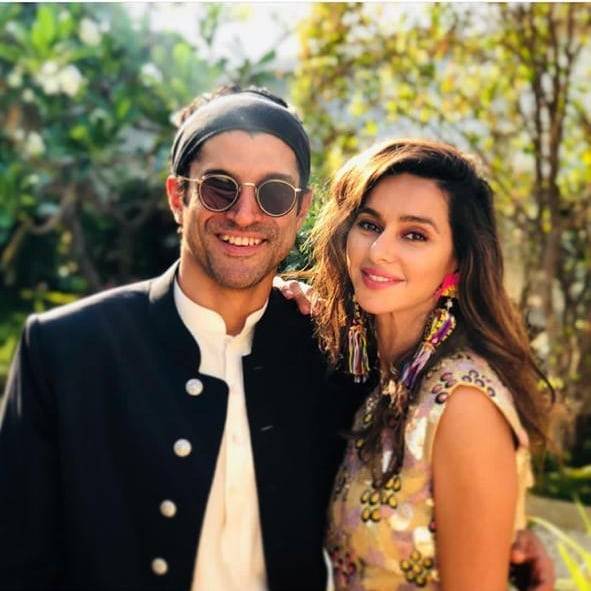 Farhan Akhtar and Shibani Dandekar smiling and posing for camera - celebrity couples 2021