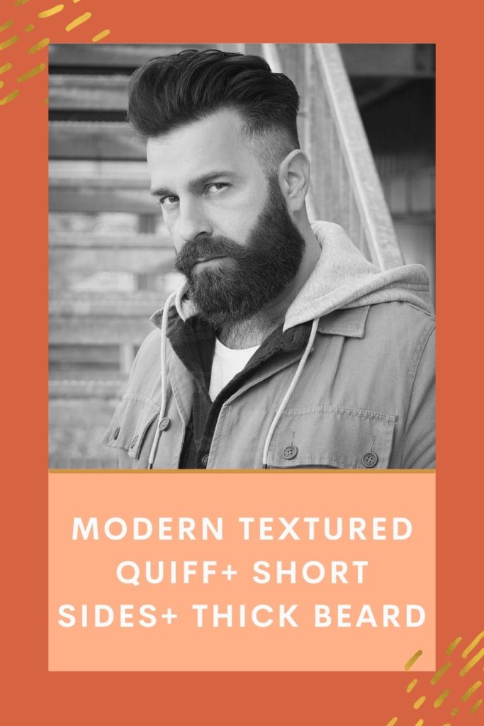 Guy is posing in a tough look and showing off his Modern textured quiff+ Short sides+ Thick beard - short beard styles older man