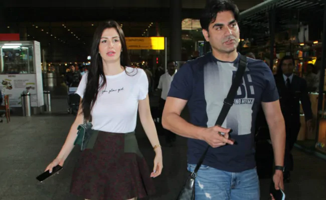 Arbaaz Khan and Giorgia Andriani walking on road - indian celebrity couples