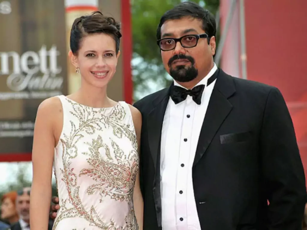 Kalki Koechlin in white dress and Anurag Kashyap in black suit posing for camera - most expensive divorce 2021