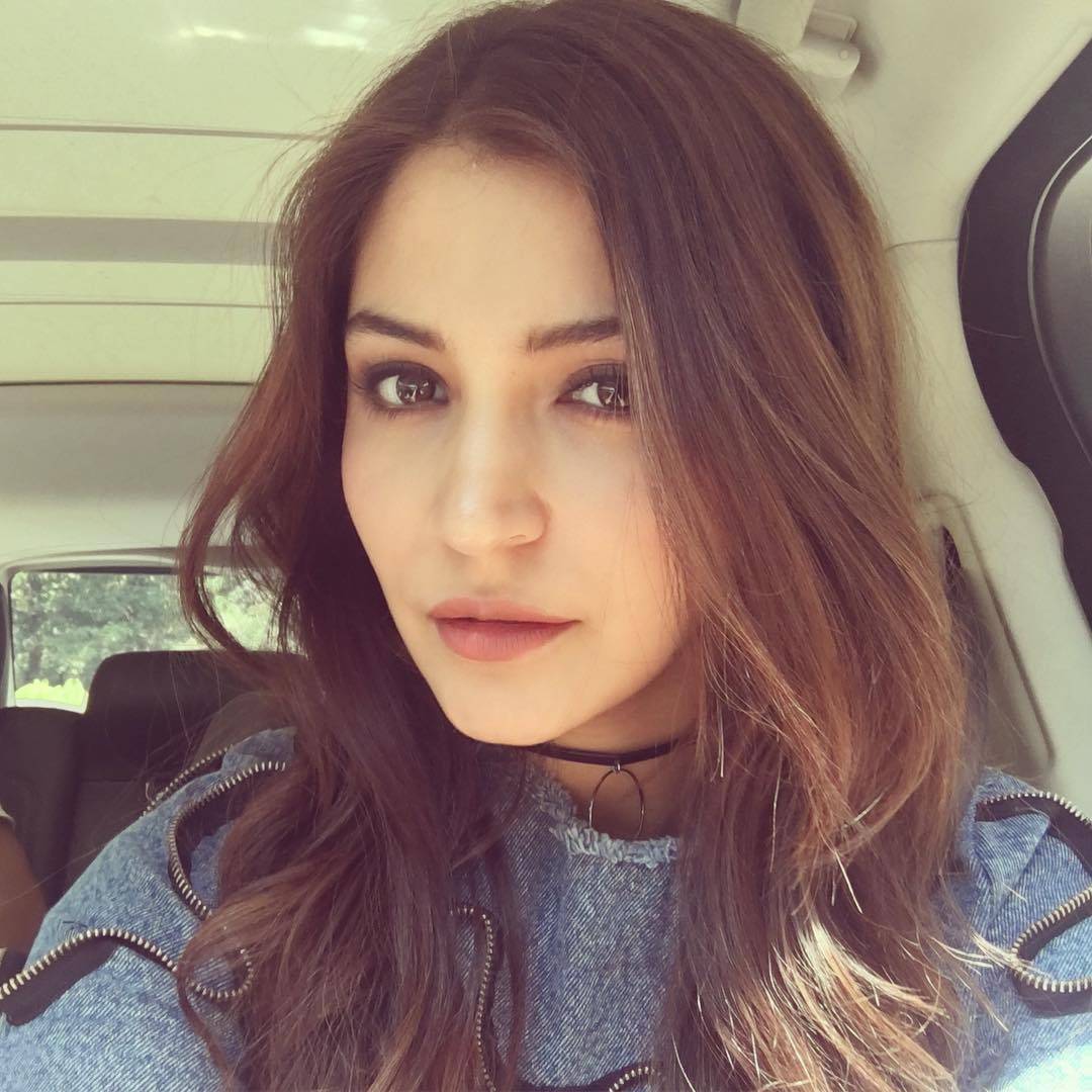 Anushka in blue dress showing her Curly long bob parted on the side in a selfie - Anushka Sharma Latest Hairstyles