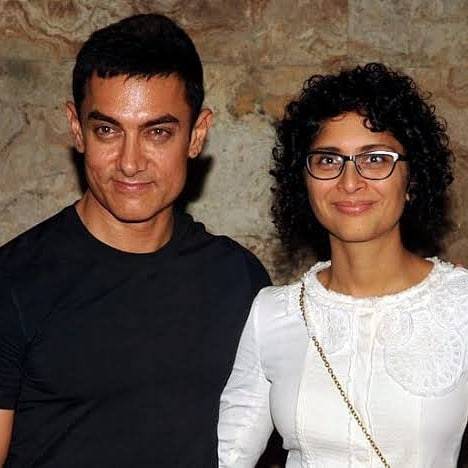 Amir khan in black t-shirt and Kiran Rao in White dress smiling nd posing for Camera - Most Expensive divorce 2021