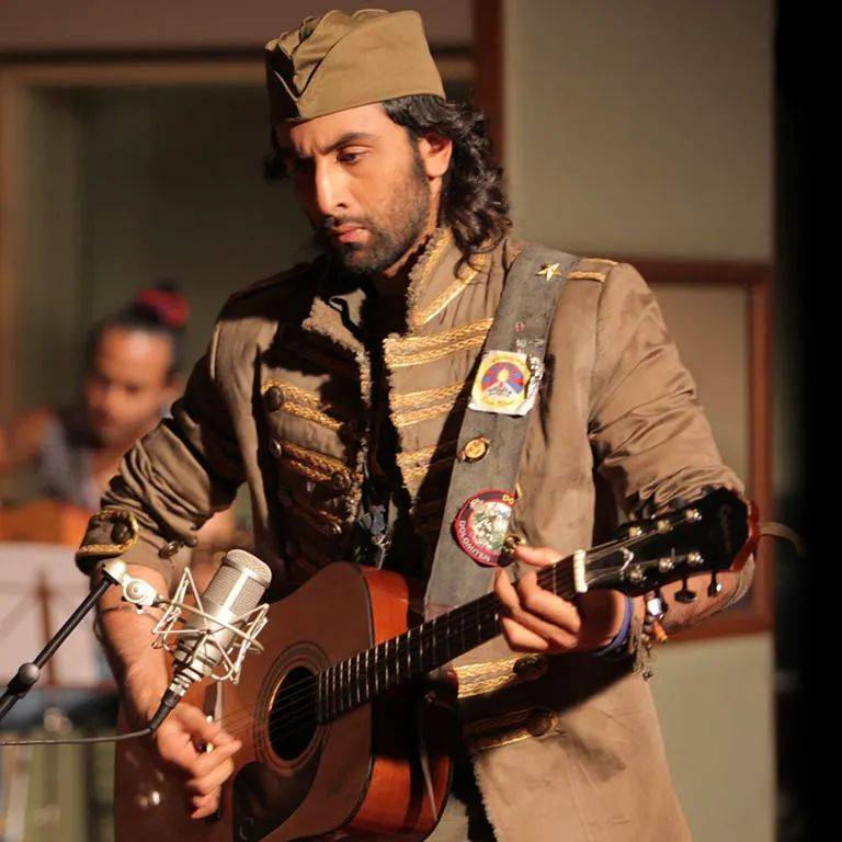 Rabir in matching grey outfit and cap posing with Guitar - Ranbir Kapoor hairstyles 2021