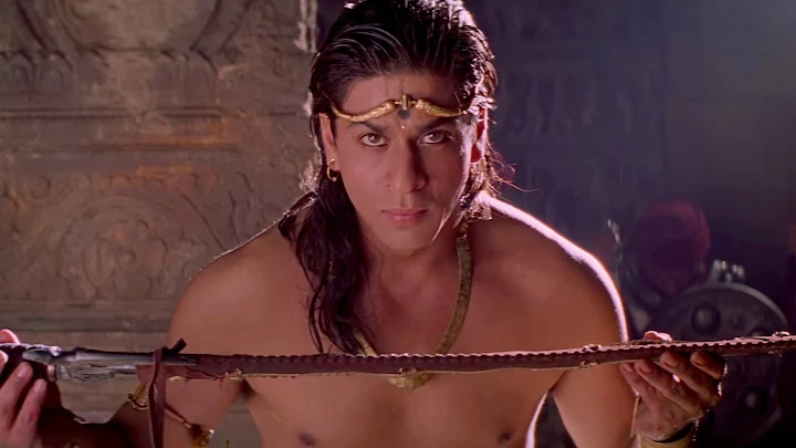 Shahrukh khan holding a sword in his long hairstyle - shahrukh khan long hairstyles