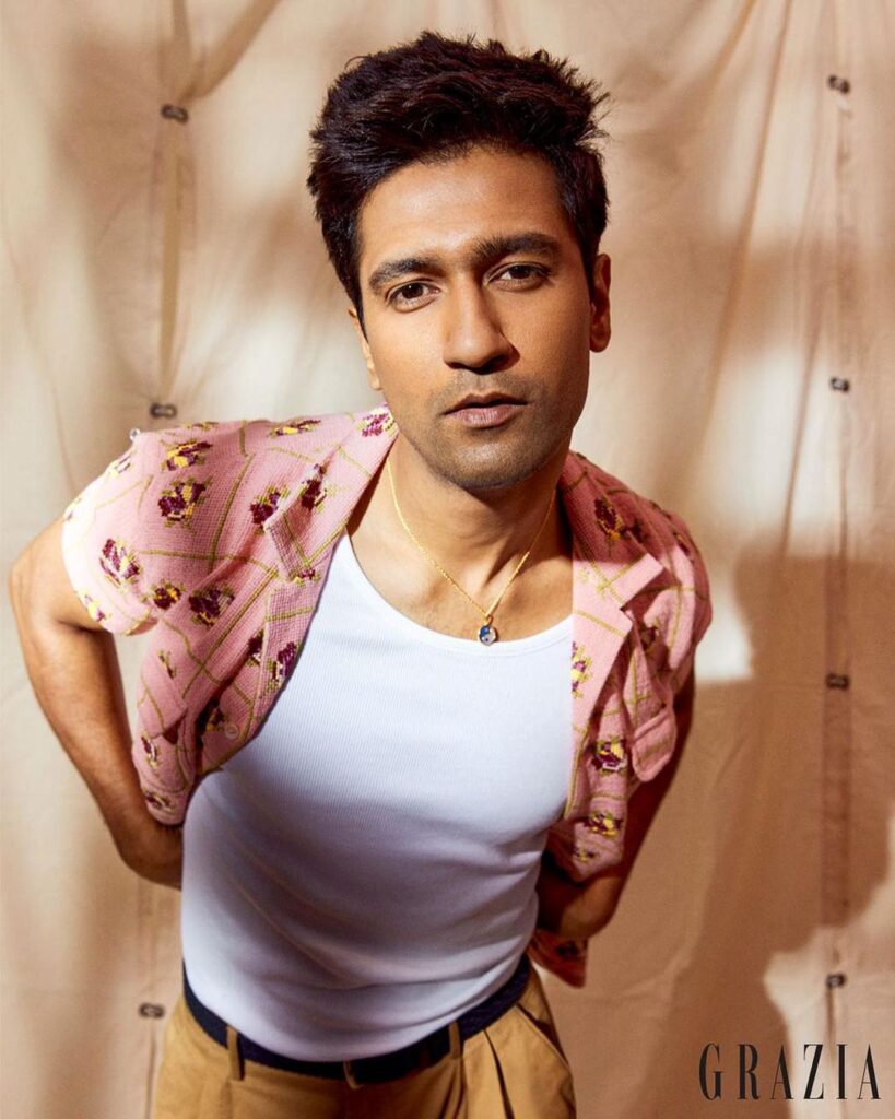 Vickey Kaushal in Pink floral Shirt and white inner showing his Classic guy next door hairdo - Vicky Kaushal Hairstyle 2021