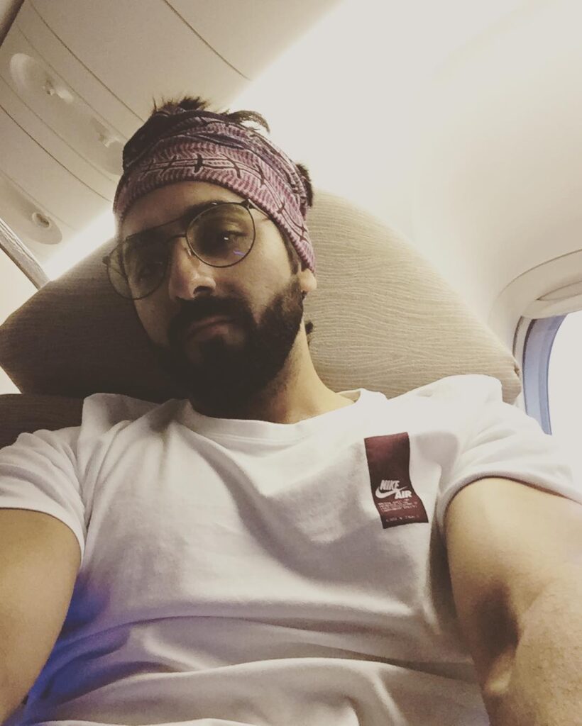 Ayushmann posing for selfie with Long messy with bandana hairstyle - Ayushmann Latest Hairstyle