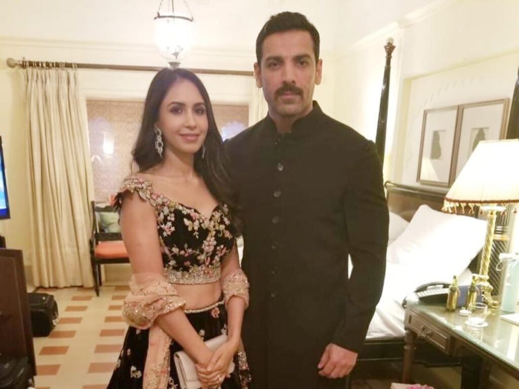 John Abraham posing for Camera with his wife Priya Runchal - Indian Celebrities who married late