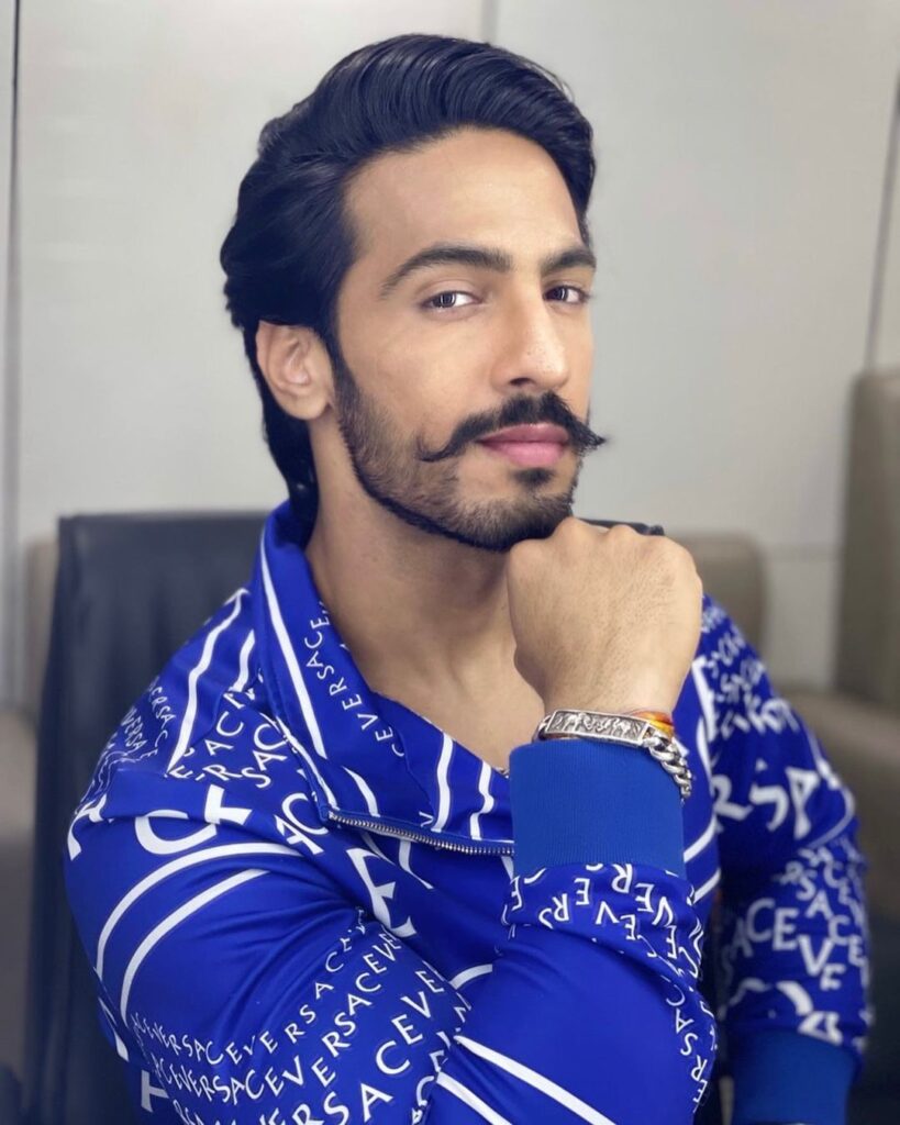 Thakur Anoop Singh in blue and white printed shirt showing his side-swept hairstyle - Thakur Anoop Singh Hairstyles 2021
