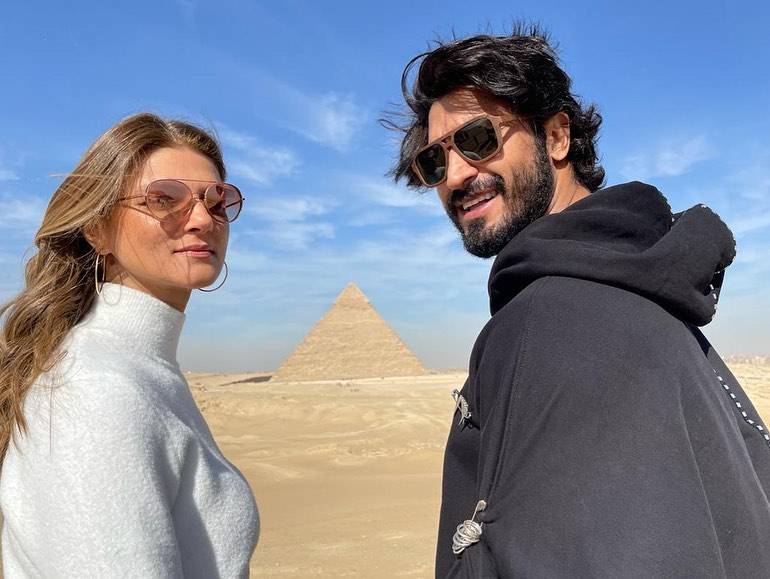 Vidyut Jammwal and Nandita Mahtani wearing goggles and posing for camera in front of Pyramids - celebrities who made their relationship official in 2021