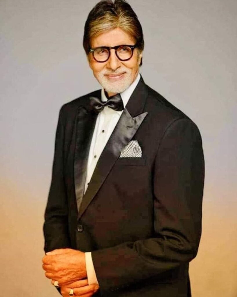 Amitab Bachan in black suit and white shirt - celebrities who have dental implants 