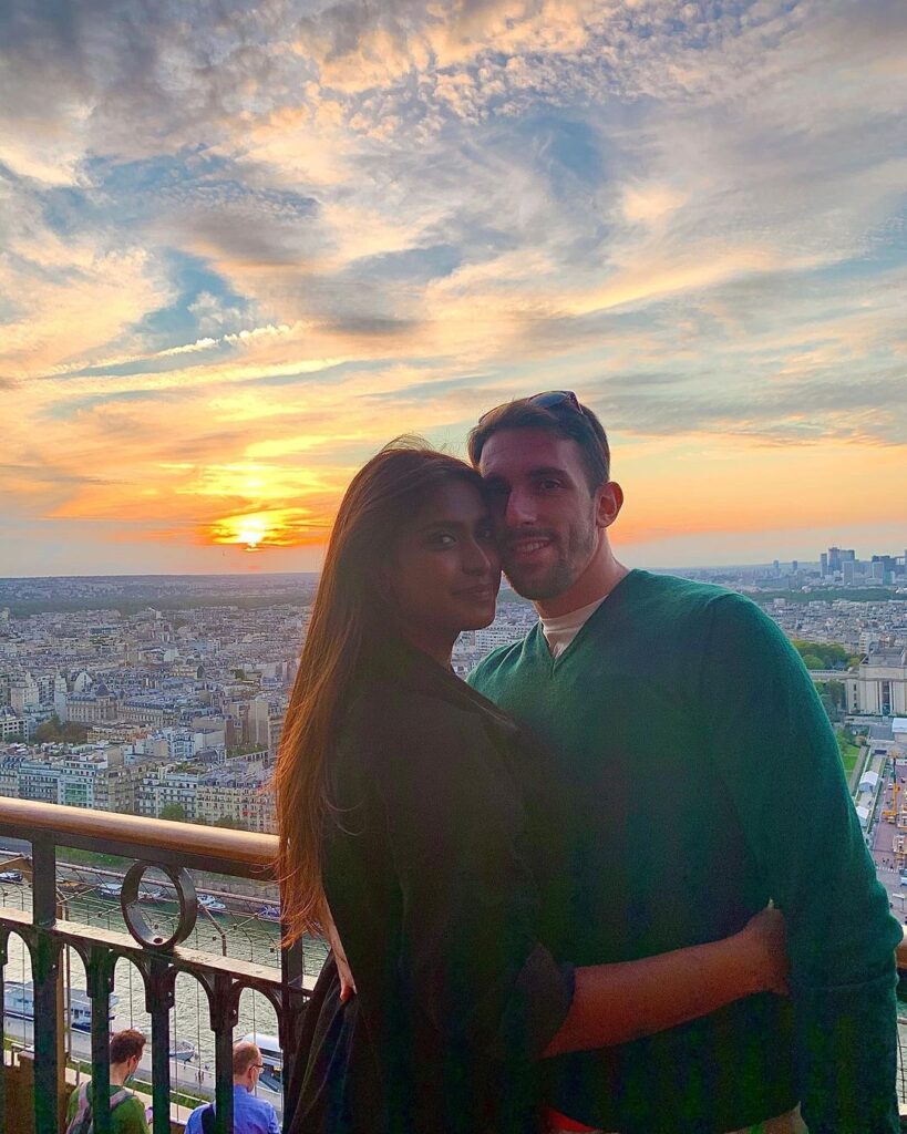 Poulomi Das & Alpaone posing for camera with sunset in background - Indian celebrity couple