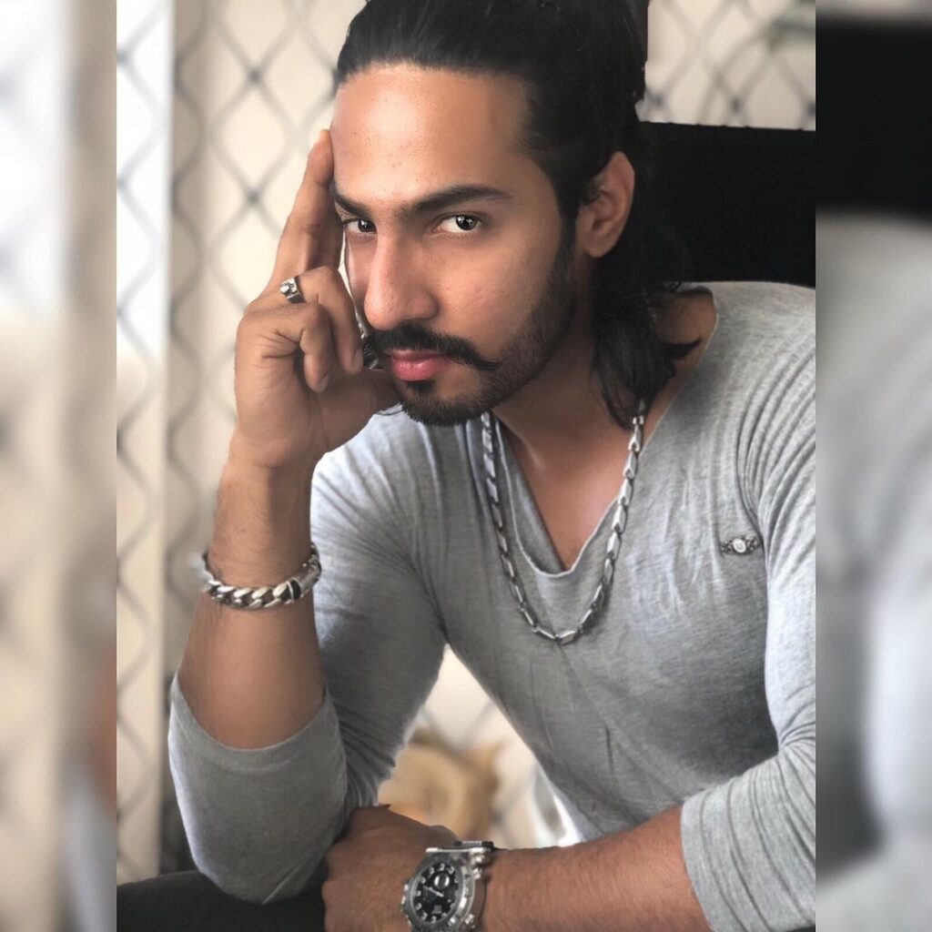 Thakur Anoop Singh Sitting in intense look - Thakur Anoop Singh long hairstyle 2021