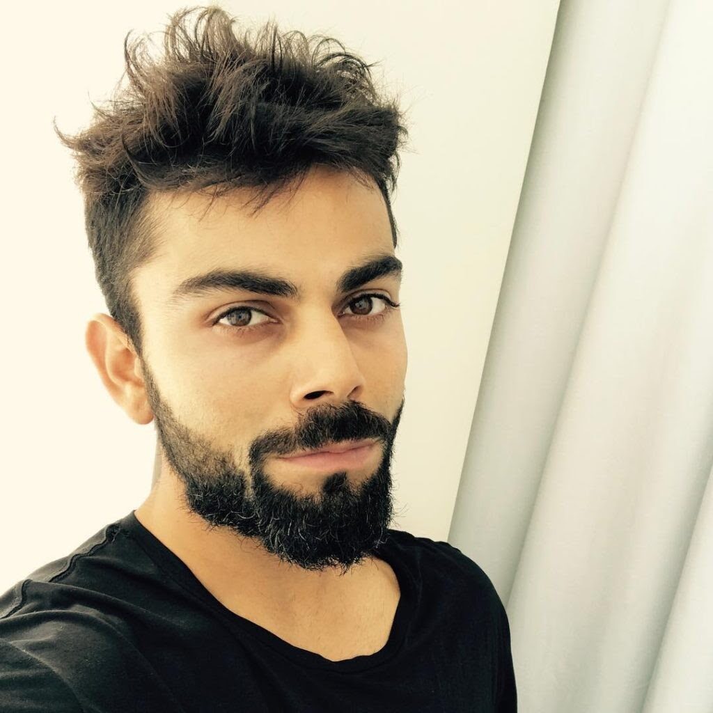 Virat Kohli in black t-shirt posing for a selfie with his messy hairstyle - Virat Kohli new hairstyle