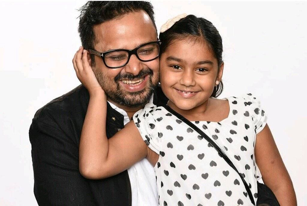 Smiling Nikhil Advani with her adopted daughter - celebrities who have adopted child