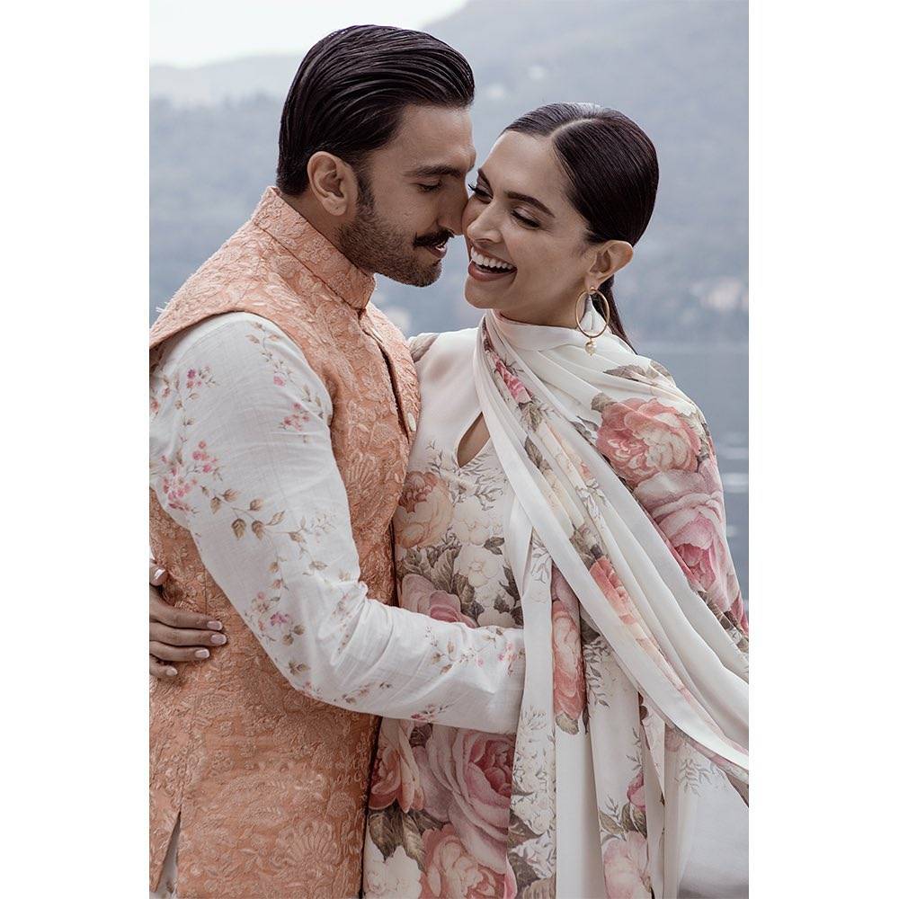 Smiing Deepika Padukone in floral traditional suit with her husband Ranveer Singh - Deepika Padukone hairstyle
