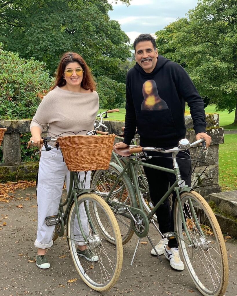 Akshay Kumar and his wife Twinkle Khanna posing with bicycles -  live in relationship