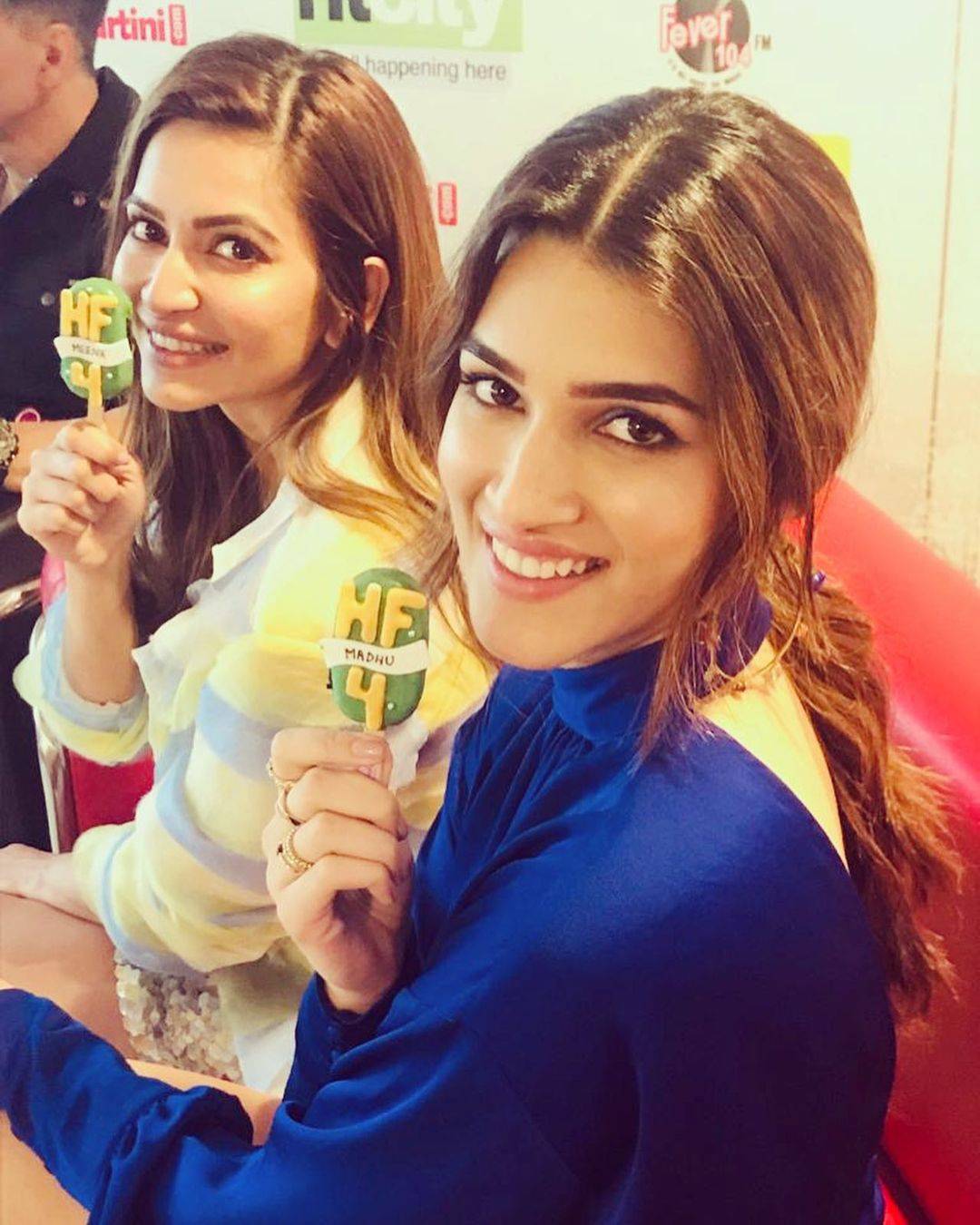 Kriti Sanon in Blue outfit with actress Kriti Kharbanda posing for camera - hairstyles for thin girls