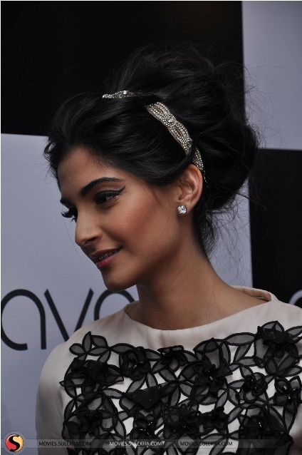 Sonam Kapoor in black and white dress and old school hairstyle - woman hair care regime