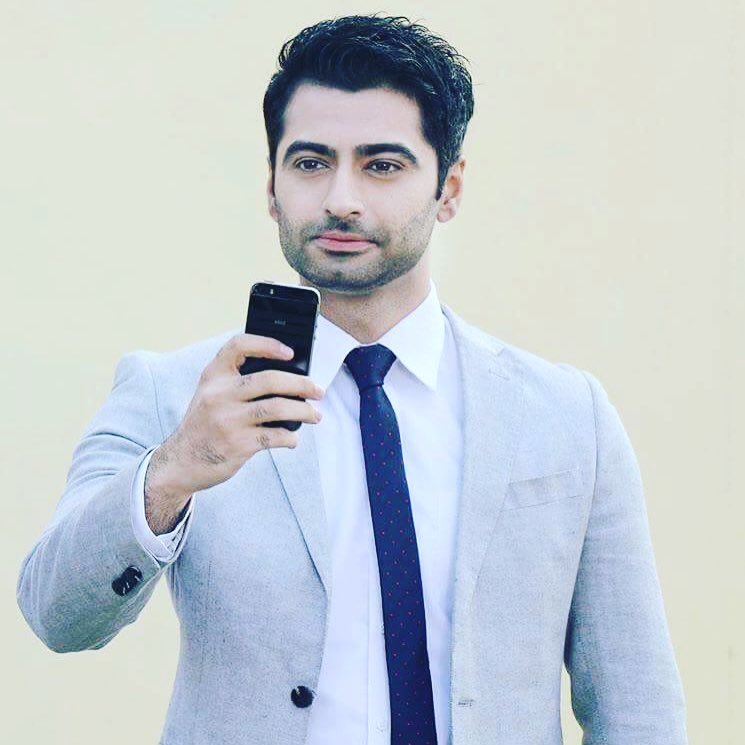 Harshad Arora posing for camera in sky blue suit with dark blue tie - male models in india 2022