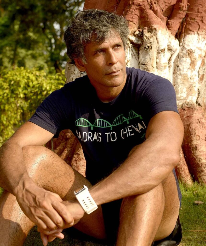 Milind Soman sitting in blue printed t-shirt - male models in India