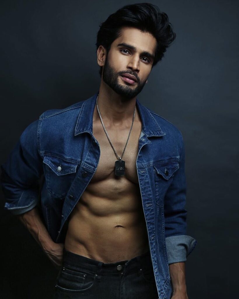 With open denim shirt Rohit Khandelwal posing for camera - male model in India