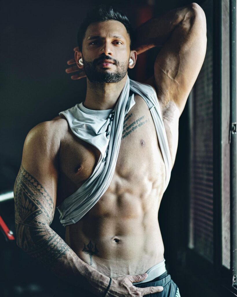 Prathamesh Maulingkar posing for camera in low waist jeans and grey inner - models in India
