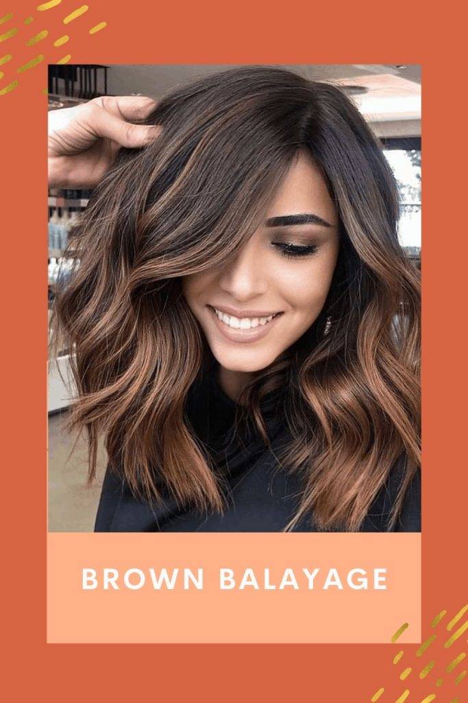 A smiling girl is showing her Brown Balayage - hairstyles for tall girls