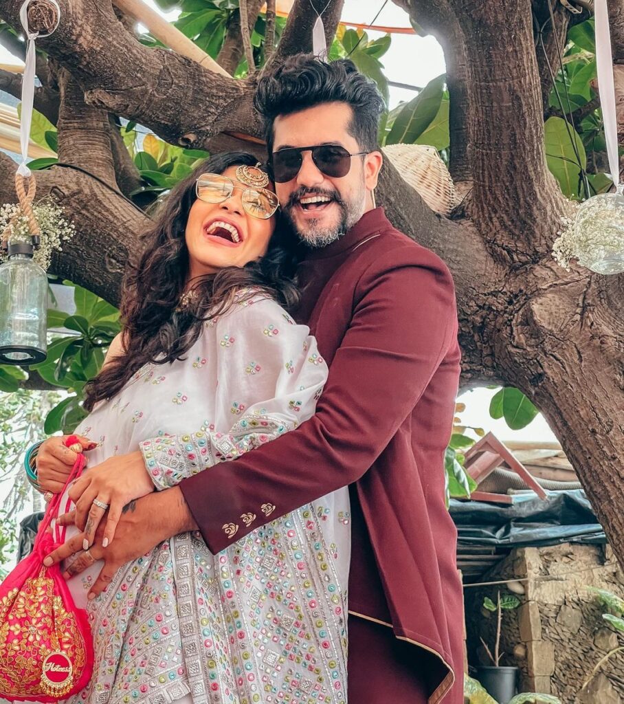 Kishwar Merchant in pink traditional dress and and Suyyash Rai in marron coat posing for camera - husband wife age difference age