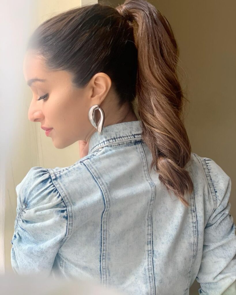 Shraddha Kapoor in light blue denim jacket with high ponytail posing for camera - celebrity hairstylist