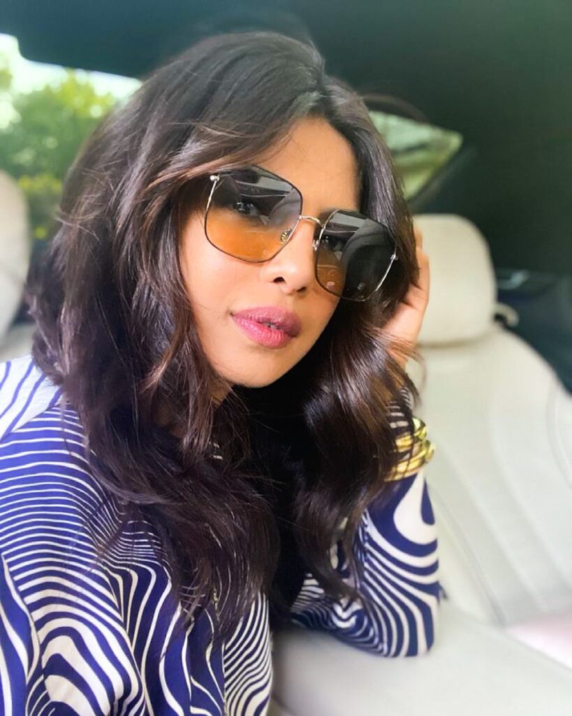 Priyanka Chopra in goggles and blue and white dress - latest hairstyles of Priyanka Chopra